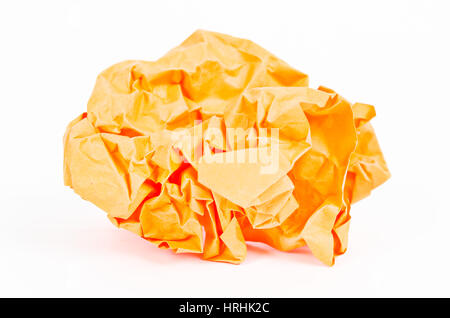 Close-Up Of An Orange Crumpled Paper Ball On A White Background Stock Photo