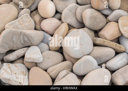 Large amount rounded and polished beach rocks Stock Photo