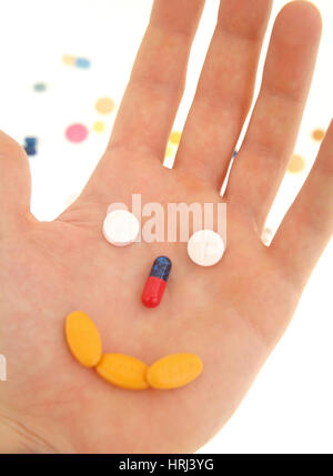 freundliches Gesicht aus Tabletten in der Handfl?che - friendly face of tablets in hand Stock Photo