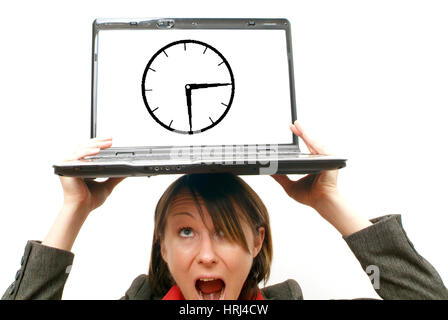 Gesch?ftsfrau mit Laptop am Kopf, Symbolbild Unter Zeitdruck stehen - business woman with laptop on head, symbolic for to be pressed for time Stock Photo