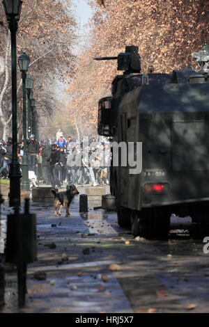 Chilean police water cannon disperse protesters during a student strike in Santiago's Downtown, Chile. Protesters Stock Photo