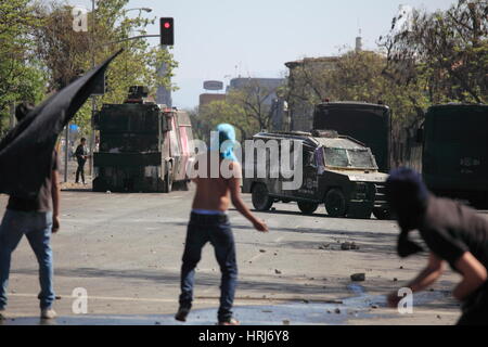 Chilean police water cannon disperse protesters,during a student strike in Santiago's Downtown, Chile. Stock Photo