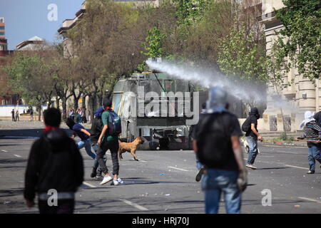 Chilean police water cannon disperse protesters,during a student strike in Santiago's Downtown, Chile. Stock Photo