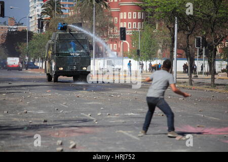 Chilean police water cannon disperse protesters,during a student strike in Santiago's Downtown, Chile. Stock Photo