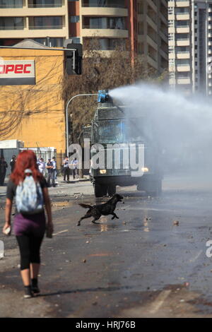 Chilean police water cannon disperse protesters,during a student strike in Santiago's Downtown, Chile. Stock Photo