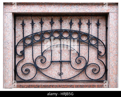 Black steel lattice in a rectangular niche of a red granite wall. Isolated  mass architecture fragment Stock Photo