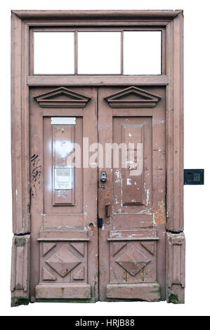 Rotten curve pink vintage door. Peeling paint and scraps of old paper ads. Isolated on white with patch. Stock Photo