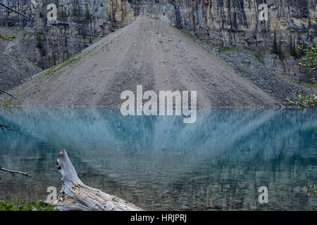 Lake Maligne with reflection of gravel heap near Jasper National Park, Alberta, Canada Stock Photo