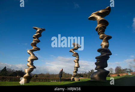 Lydia Turnbull views a work titled Points of View, 2013, by artist Tony Cragg, part of the UK's largest exhibition at the Yorkshire Sculpture Park.
