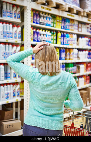 Woman in a store with the shopping cart Stock Photo