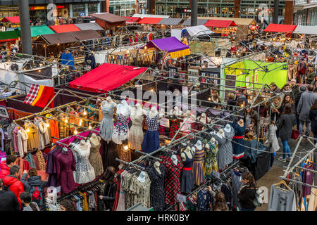 Old Spitalfields Market on a Sunday morning packed with all sorts of products from artisans and speciality foods for sale, East London, England UK Stock Photo