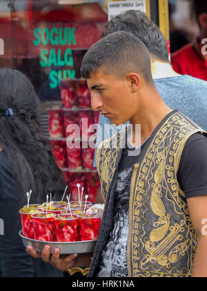 YOUNG TURKISH WAITER SERVING SOFT DRINK ON TRAY  ISTANBUL TURKEY Stock Photo