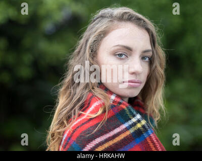 Young woman with Royal Stewart tartan shawl Stock Photo