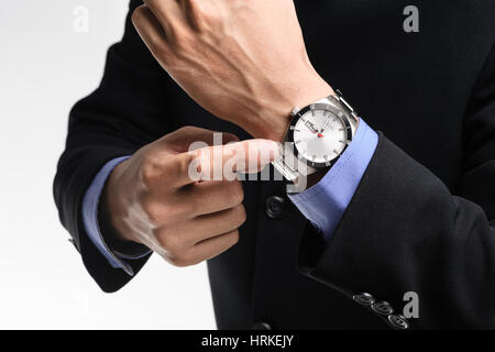 businessman pointing angrily to his watch, luxury men wristwatch Stock Photo