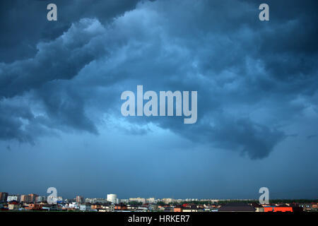 Cloudy sky before a storm over a city Stock Photo - Alamy