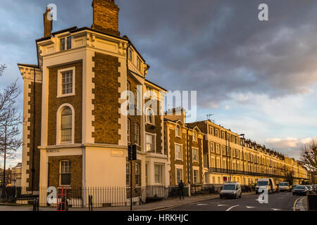 Block of flats in london at a corner during the sunset giving a very warm colors in a overcast day. Stock Photo