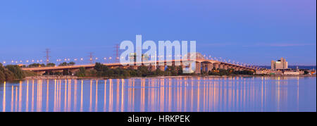 A panoramic image of the Burlington Bay James N. Allan Skyway (Burlington Skyway) at sunset. Burlington/Hamilton, Ontario, Canada. Stock Photo