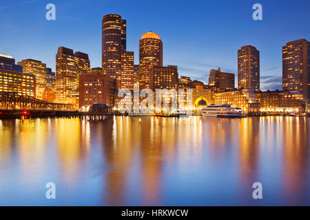 The skyline of downtown Boston, Massachusetts from across the water at dusk. Stock Photo