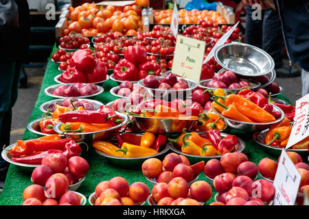 Variety of coloured bell peppers and other vegetable on display at Borough Market in London Stock Photo