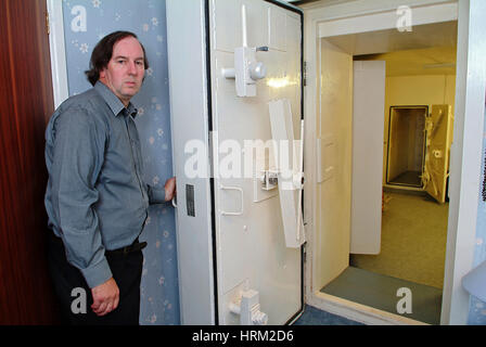 Mike Thomas and his house at Hillhead nr.Kingswear, Devon which has a nuclear bunker. pix show the main entrance which is hidden behind a bedroom Stock Photo