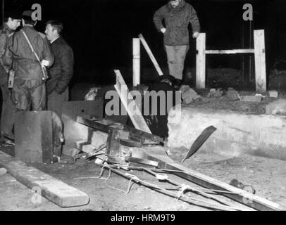 Soldiers and police examine a automatic barrier which the army had erected on the border between Strabane, Northern Ireland, and Lifford in the Irish Republic after it had been destroyed by an IRA terrorist unit. The barrier was the first in a series that was going to provide a ring of steel on the cross border roads. Stock Photo