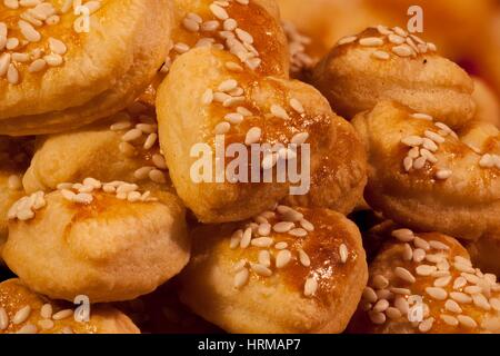 fresh roasted ruddy bread with sesame seeds macro shot background Stock Photo