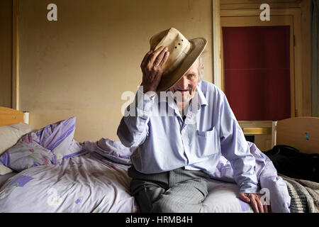 Bedridden man living alone in social housing UK Stock Photo