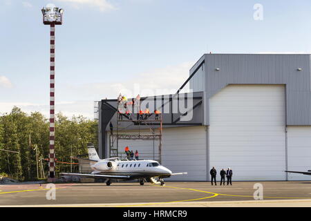 OSTRAVA, CZECH REPUBLIC - SEPTEMBER 22: Business jet Cessna Citation Excel 560XL stands in front of airport hangar on September 22, 2012 in Ostrava, C Stock Photo