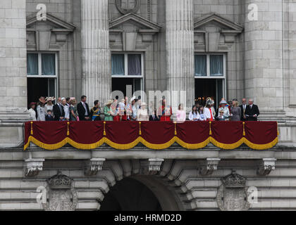 The Royal Family including Her Majesty Queen Elizabeth II stand on the balcony at Buckingham Palace awaiting the Queens Birthday Flypast Stock Photo
