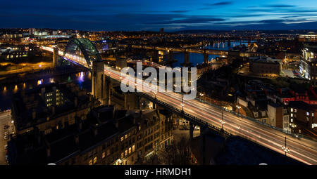 A view at dusk of the Newcastle bridges and quayside in Newcastle Upon Tyne looking towards Gateshead Stock Photo