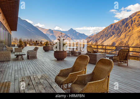 Countryside in Georgia. View of terrace and village surrounded by mountains. Stock Photo