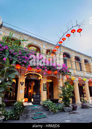 Old building with garland of lanterns in Hoi An Ancient Town. Hoi An, Quang Nam Province, Vietnam. Stock Photo