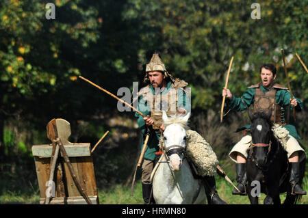 CLUJ-NAPOCA, ROMANIA - OCTOBER 3: Members of Eagles of Calata Nomadic group performing a free equestrian demonstration with Hunnic and archaic Hungari Stock Photo