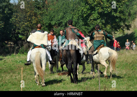 CLUJ-NAPOCA, ROMANIA - OCTOBER 3: Members of Eagles of Calata Nomadic group performing a free equestrian demonstration with Hunnic and archaic Hungari Stock Photo