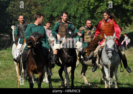 CLUJ-NAPOCA, ROMANIA - OCTOBER 3: Members of Eagles of Calata Nomadic group performing a free equestrian demonstration with Hunnic and archaic Hungari Stock Photo