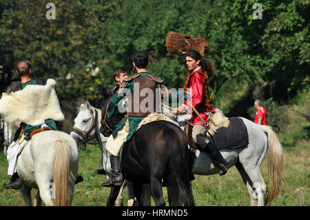 CLUJ-NAPOCA, ROMANIA - OCTOBER 3: Members of Eagles of Calata Nomadic group performing a free equestrian demonstration with Hunnic and archaic Hungari Stock Photo