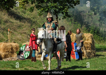 CLUJ-NAPOCA, ROMANIA - OCTOBER 3: Members of Eagles of Calata Nomadic group performing a free equestrian demonstration with Hunnic and archaic Hungari Stock Photo