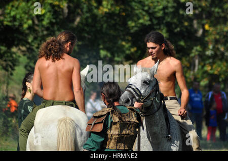 CLUJ-NAPOCA, ROMANIA - OCTOBER 3: Members of Eagles of Calata Nomadic group performing a free equestrian demonstration with Hunnic and archaic Hungari Stock Photo