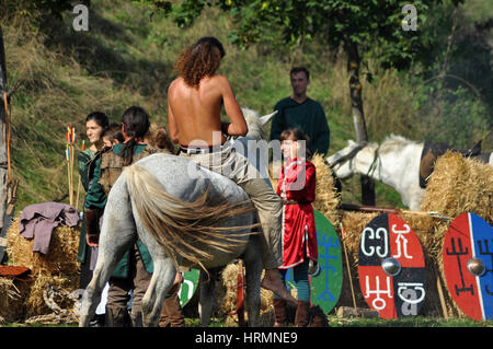 CLUJ-NAPOCA, ROMANIA - OCTOBER 3: Members of Eagles of Calata Nomadic group performing a free equestrian demonstration with Hunnic and archaic Hungari Stock Photo