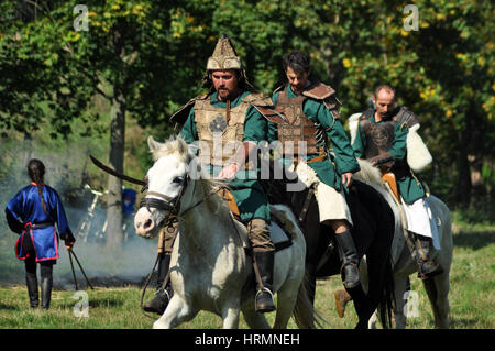 CLUJ-NAPOCA, ROMANIA - OCTOBER 3: Members of Eagles of Calata Nomadic group performing a free equestrian demonstration with Hunnic and archaic Hungari Stock Photo