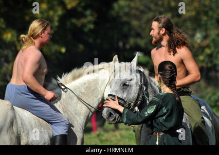 CLUJ-NAPOCA, ROMANIA - OCTOBER 3: Members of Eagles of Calata Nomadic group performing a free equestrian demonstration with Hunnic and archaic Hungari Stock Photo