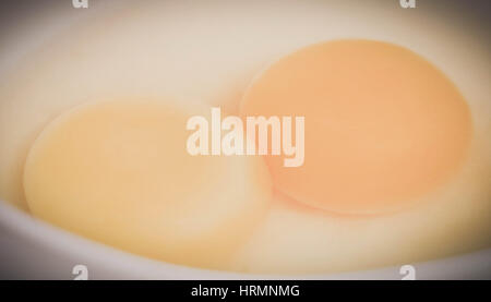 Closeup of two yolks in a bowl Stock Photo
