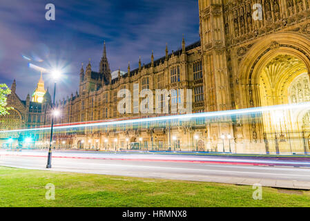 Houses of Parliament at night with ligh trails Stock Photo