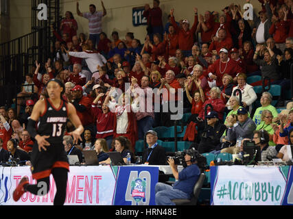 Conway, South Carolina, USA. 3rd Mar, 2017. NC State fans cheer as NC State takes the lead in the fourth during the game between the Louisville Cardinals and the North Carolina State Wolfpack in the ACC Women's Tournament on March 3, 2017 at HTC Center in Conway, SC. Lousiville defeated NC State 59-58. William Howard/CSM Credit: Cal Sport Media/Alamy Live News Stock Photo