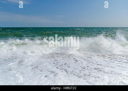 crashing waves on beach Stock Photo