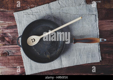 Frying pan frying pans and a wooden paddle, the view from the top, vintage toning Stock Photo