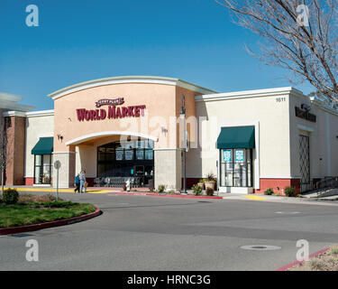 Front lateral view of a Cost Plus World Market store at Nut Tree Plaza, Vacaville, California, USA, on a sunday morning, with a couple waking into it Stock Photo