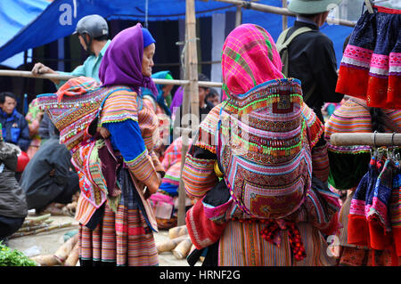 SAPA, VIETNAM - FEBRUARY 22, 2013: Hmong women at Bac Ha market in Northern Vietnam. Bac Ha is hilltribe market where people come to trade for goods i Stock Photo