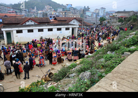 SAPA, VIETNAM - FEBRUARY 22, 2013: Crowd of Hmong people at Bac Ha market, Northern Vietnam. Bac Ha is hilltribe market where people come to trade for Stock Photo