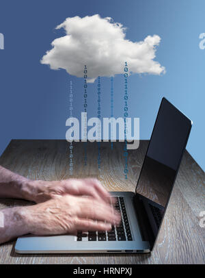 Laptop connected to applications in the cloud computing internet with furious typing suggestive of hacking Stock Photo
